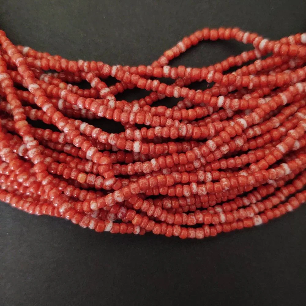 Orange and white multi strand seed bead necklace